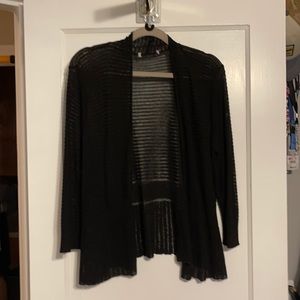 Black shrug.  Size tag missing but I wear and xlg and it fit me